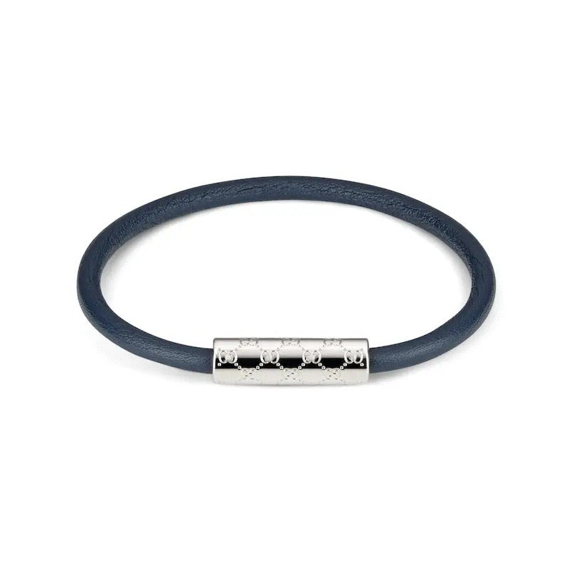 Gucci leather bracelet in dark navy with silver logo bar centerpiece and studs