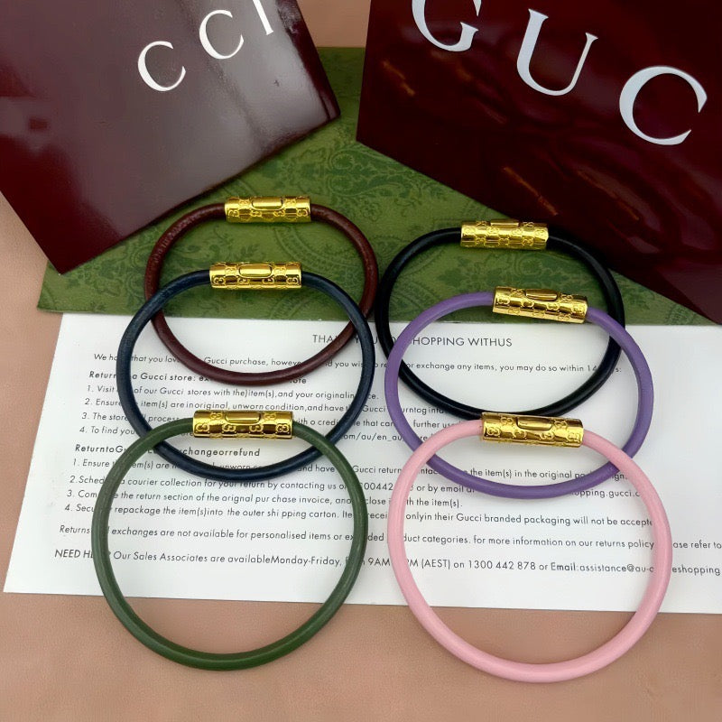 Gucci braided bracelets with logo bar clasp in green, navy, lavender, and pink (gold-tone)