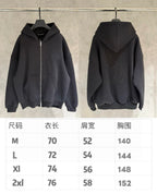 Dark zip-up hoodie shown front and back on hangers