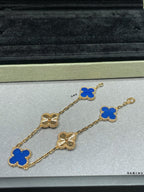Van Cleef & Arpels close-up clover bracelet with blue enamel charms on gold chain