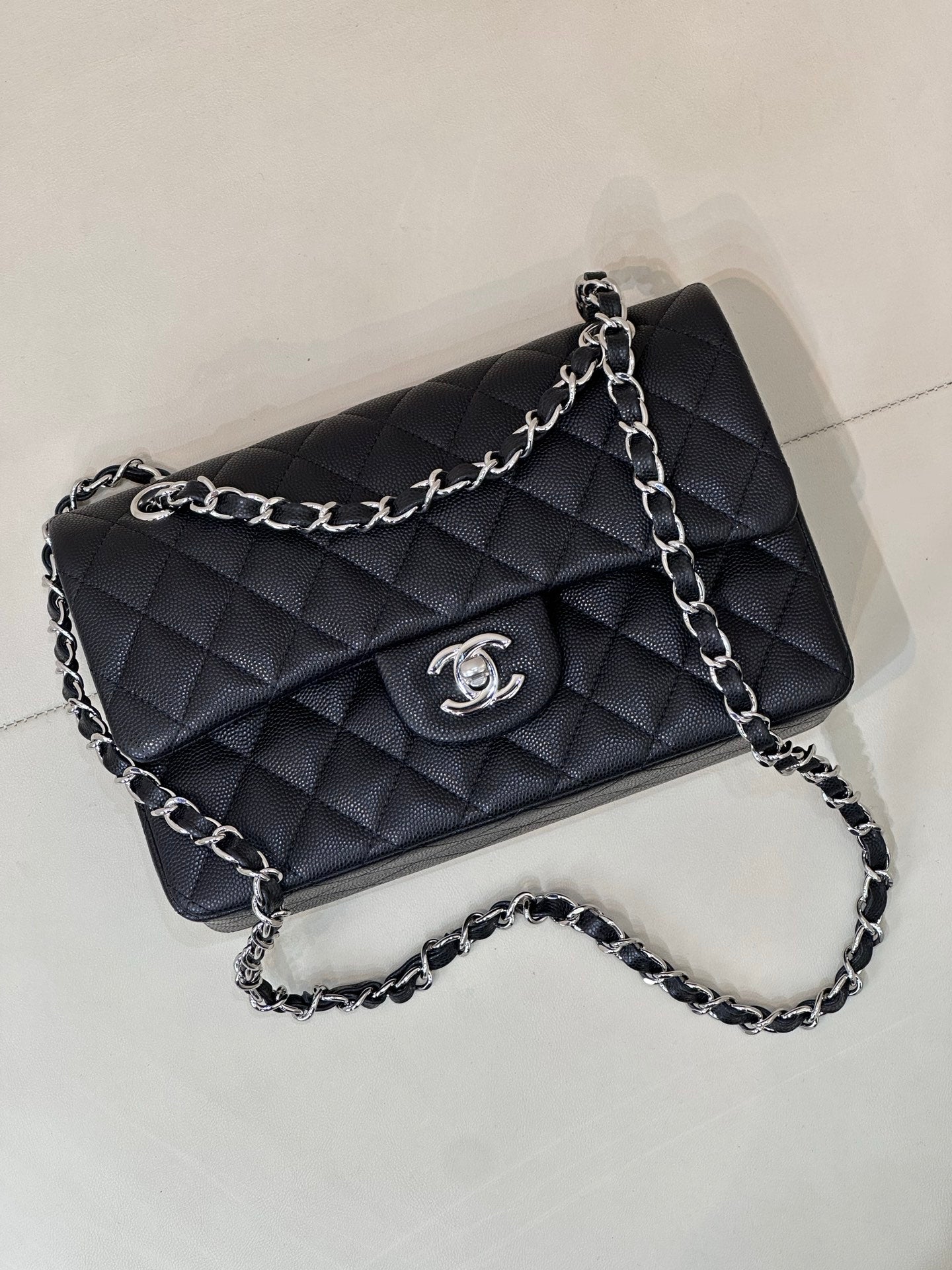 Chanel quilted shoulder bag with chain strap, flap front and CC logo emblem