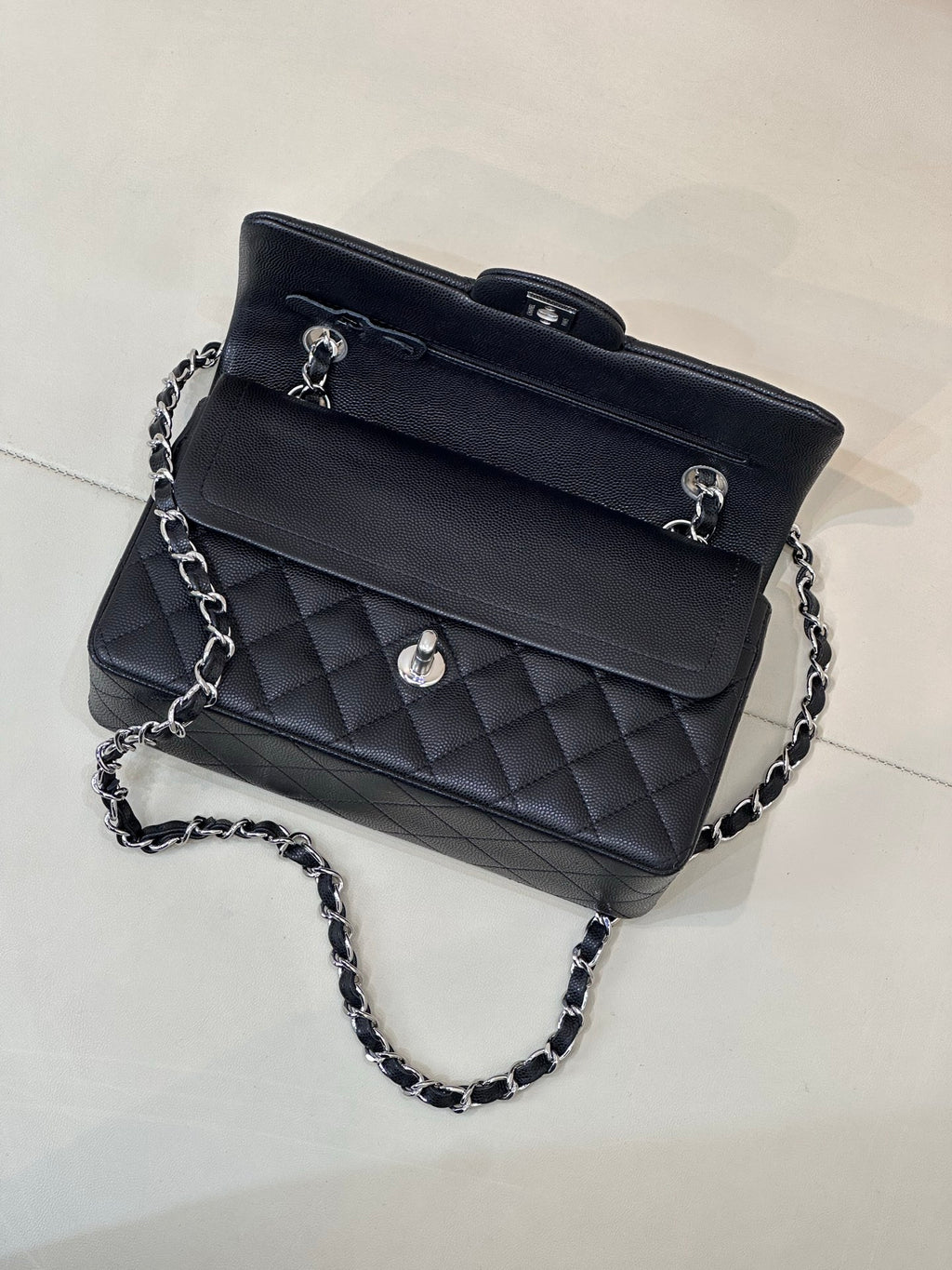 Chanel quilted shoulder bag with chain strap, top handle and front CC logo