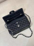 Chanel quilted shoulder bag with chain strap, open top and CC logo hardware