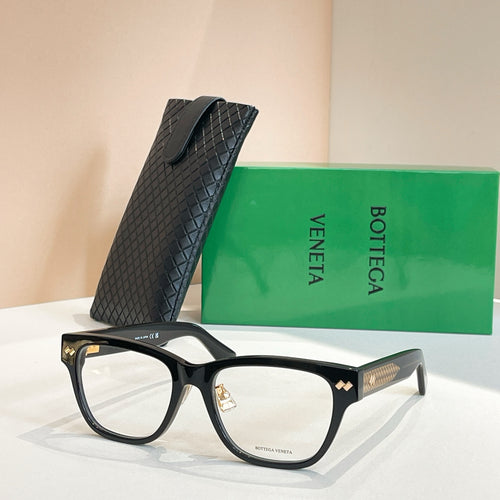 Black eyeglasses with textured geometric temples and gold logo detail