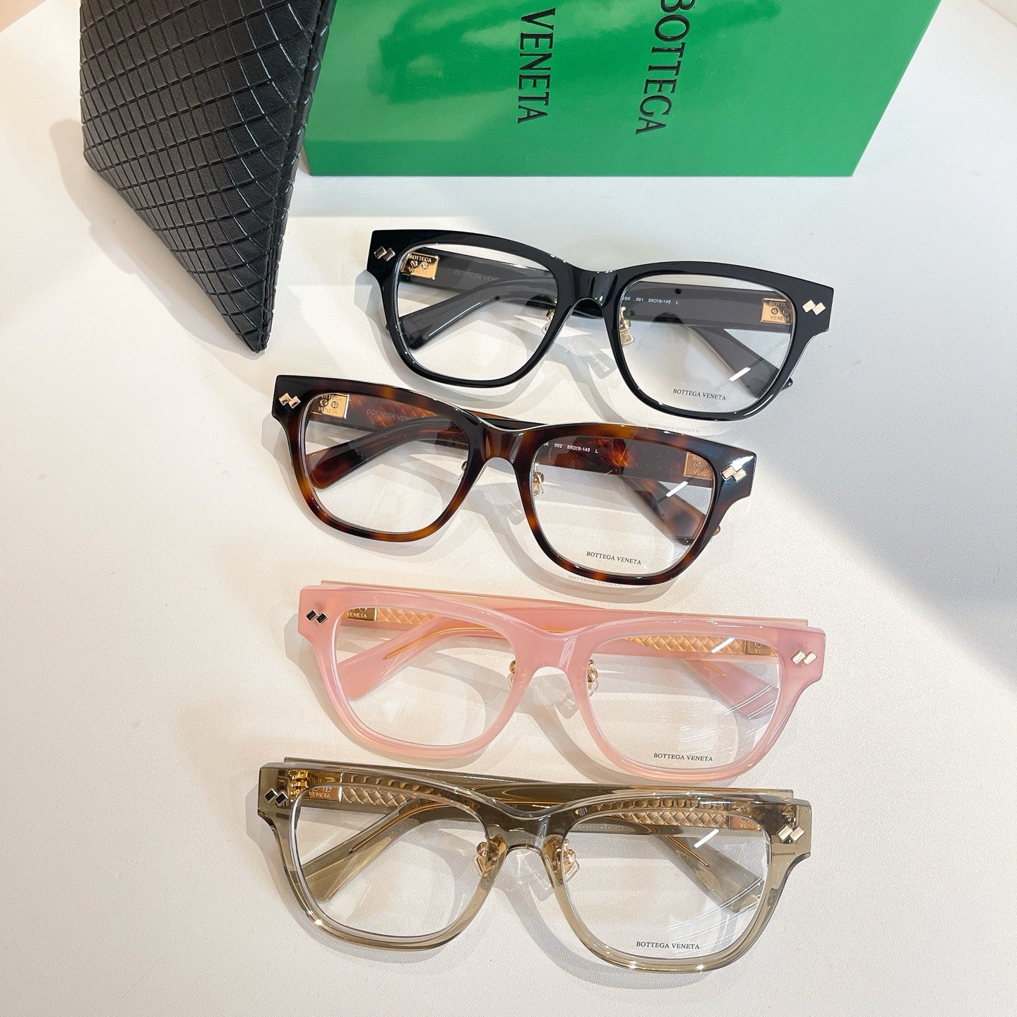 Eyeglasses assortment: black, tortoiseshell, pink, and clear frames