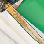 Gold-tone temple eyeglasses with embossed diamond texture and brand marks