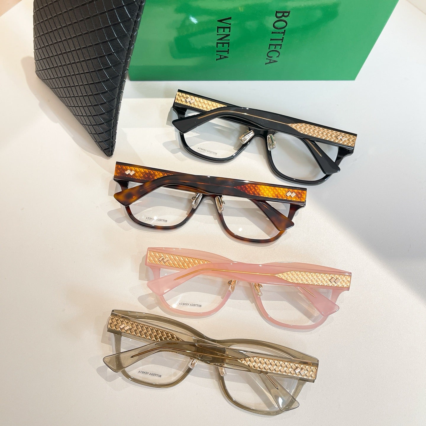Bottega Veneta eyeglasses set in black, tortoiseshell, pink, and clear frames