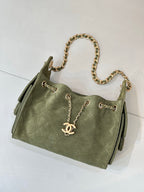 Chanel mini handbag in olive green with gold chain shoulder strap and front CC charm