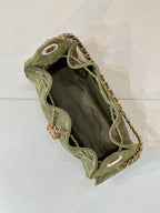 Chanel mini handbag in olive green with open top and gold chain strap interior view
