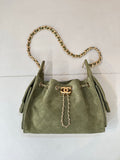 Chanel mini handbag in olive green with gold chain shoulder strap and front charm