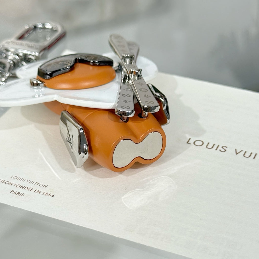 Louis Vuitton keychain charm with orange top, black trim, silver hardware and clip clasp