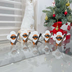 Set of Louis Vuitton keychain charms with orange leather, white caps, black monogram tabs