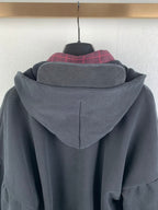 Balenciaga hooded jacket back close-up with center seam and plaid inner collar layer