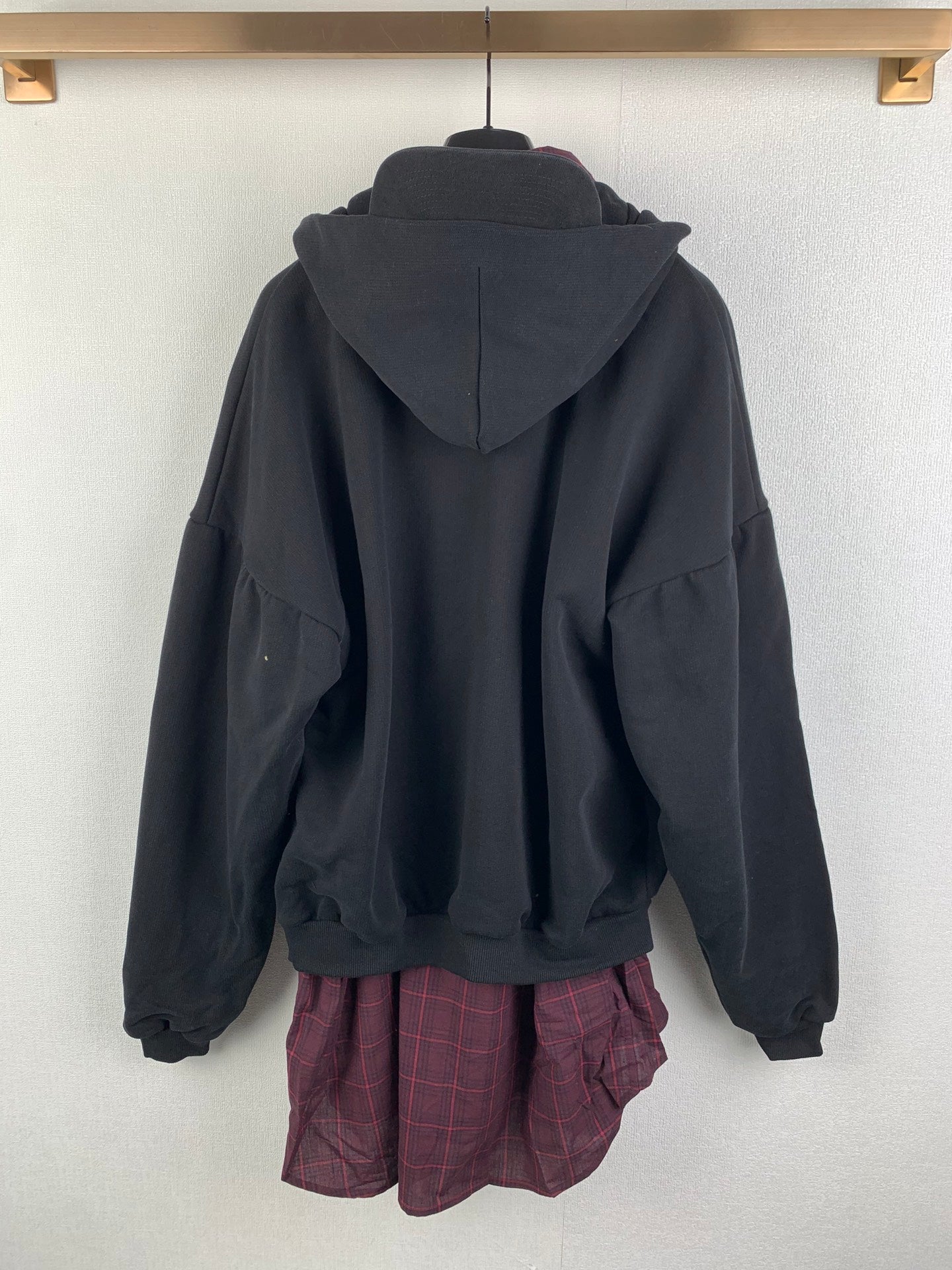 Balenciaga zip-up hooded jacket back view with hood and plaid inner layer hem