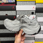 Balenciaga unisex chunky sneakers in light gray with lace-up front and curved midsole