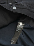 Dark blue hooded denim jacket with coin snap and size/brand care label