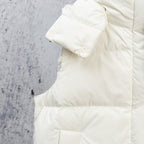 White puffer jacket shoulder and sleeve with quilted padding and cuff detail