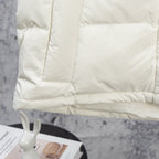 White puffer jacket lower panel with horizontal quilting and stitched hem