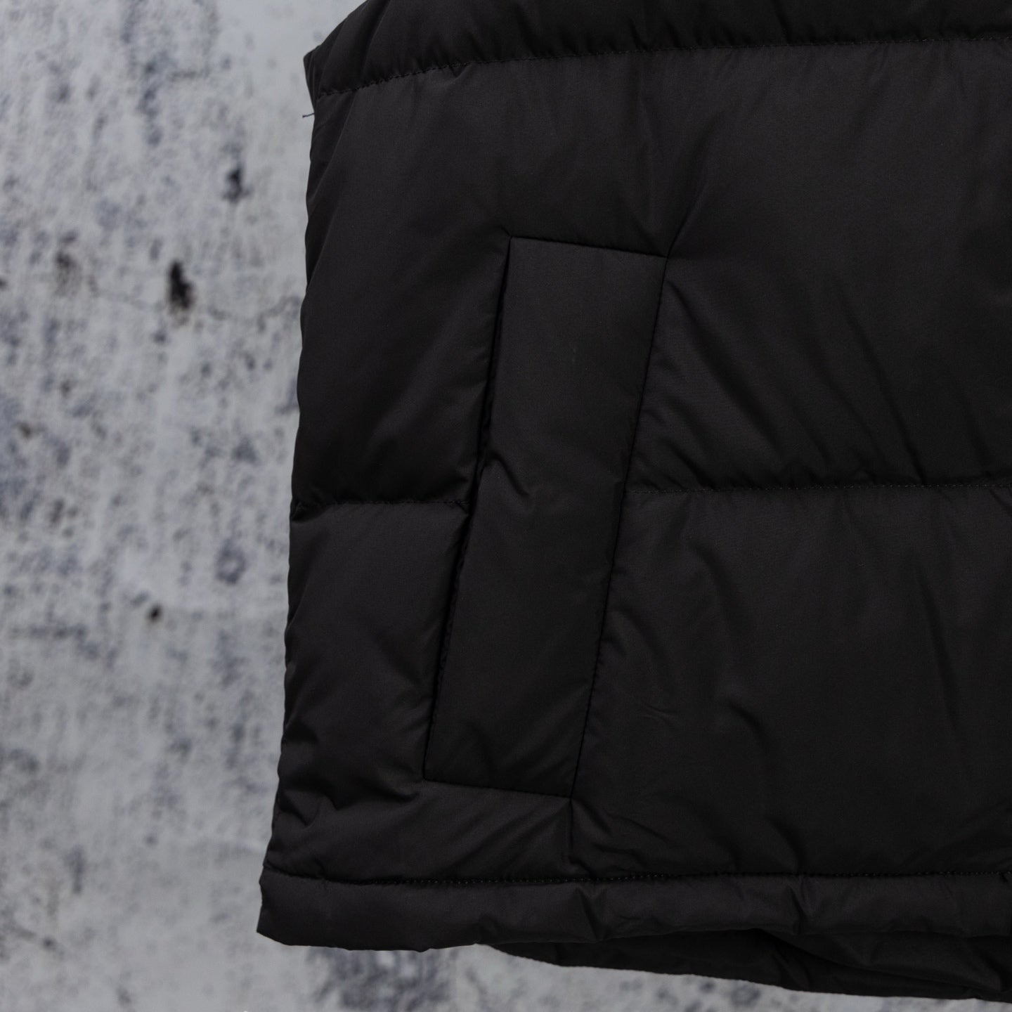 Ralph Lauren black puffer jacket panel seams and quilted lower back