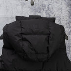 Black hooded puffer vest back view with embossed logo