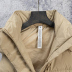 Beige puffer jacket interior view with inner lining and center placket