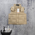 Beige puffer vest with hood, front snap buttons, and quilted panels