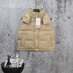 Beige puffer vest with hood, front snap buttons, and quilted panels