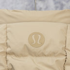 Tan puffer jacket back panel with embossed logo