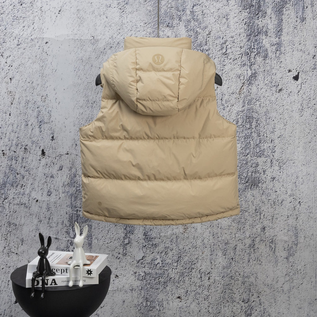 Tan hooded puffer jacket on hanger with hood and chest visible