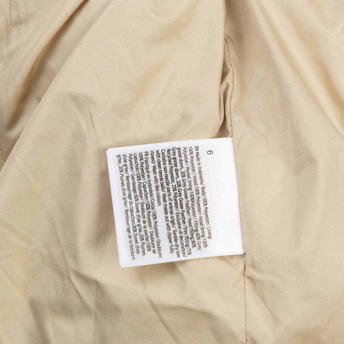 Ralph Lauren tan puffer jacket with care label on inside lining