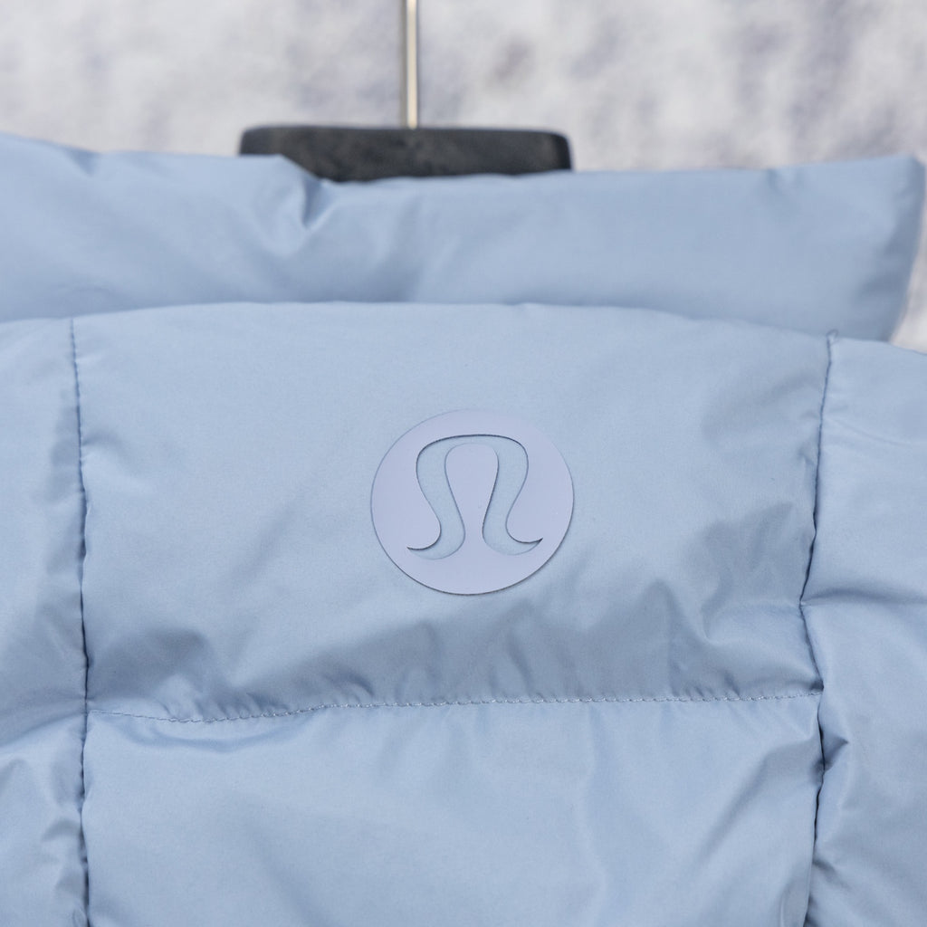 Light blue hooded puffer vest close-up of circular RL logo patch