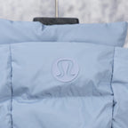 Light blue hooded puffer vest close-up of circular RL logo patch