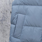 Light blue puffer vest back panel with stitched quilt box and seam lines