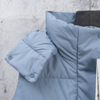 Light blue puffer vest with quilted shoulder panel and stitched flap detail