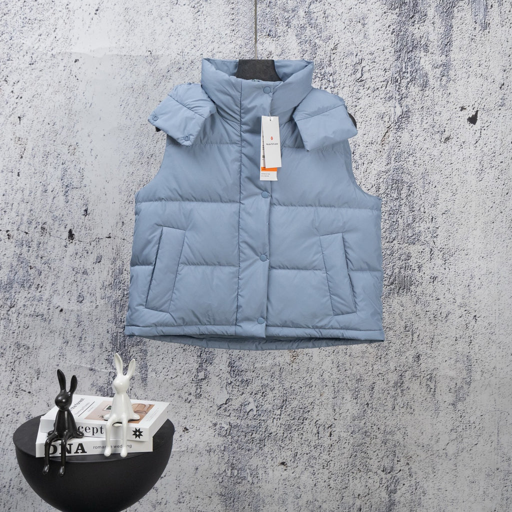 Light blue quilted puffer vest with front zipper and stand collar