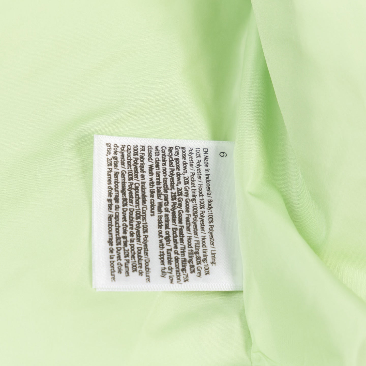 Ralph Lauren lime green puffer vest care label on fabric