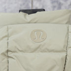 Puffer vest front, light green with circular logo patch