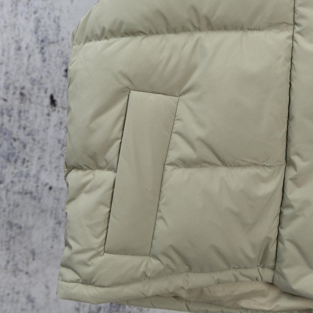 Light sage puffer vest quilted square patch and stitched panel seams