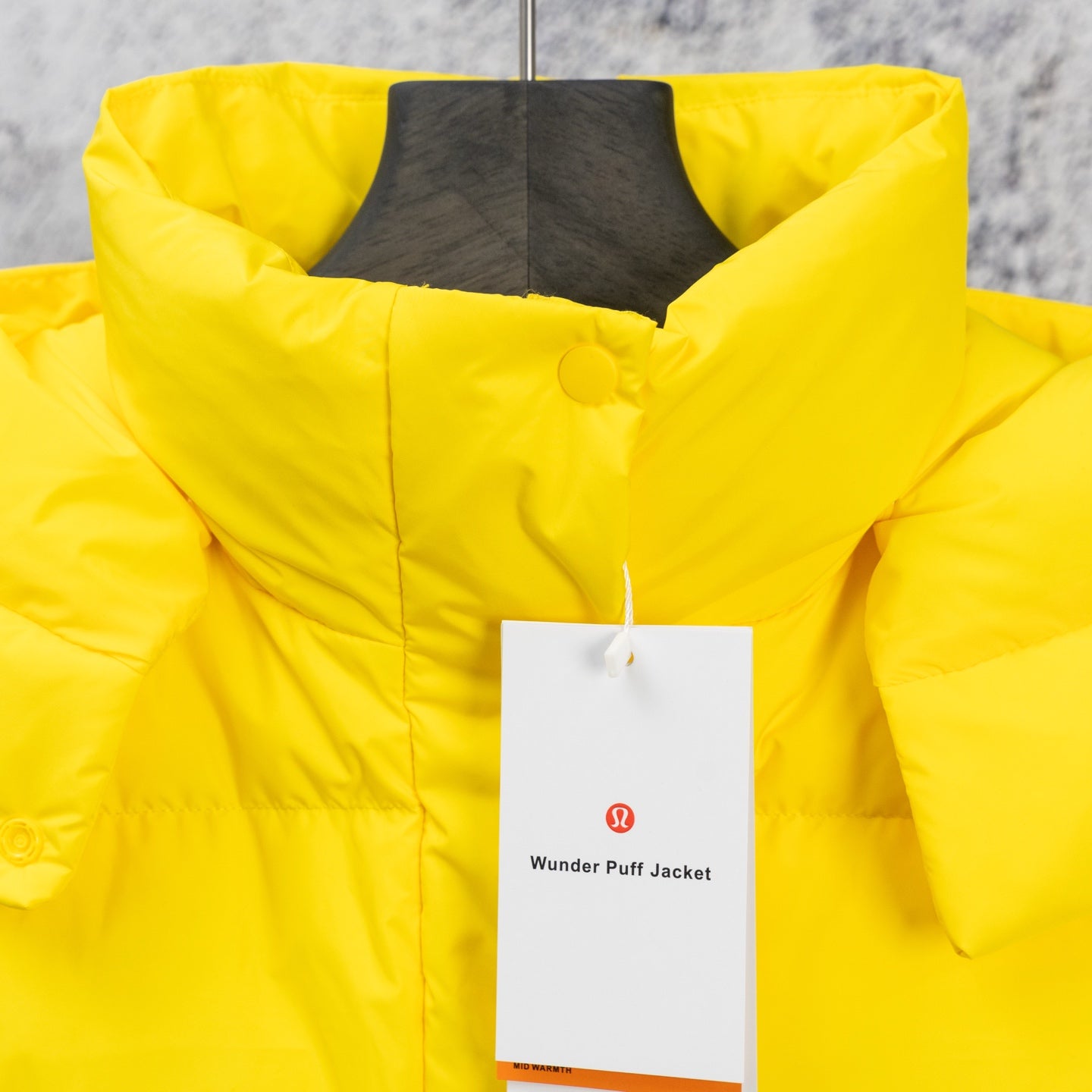 Ralph Lauren yellow puffer jacket with hood and snap front, hanging tag