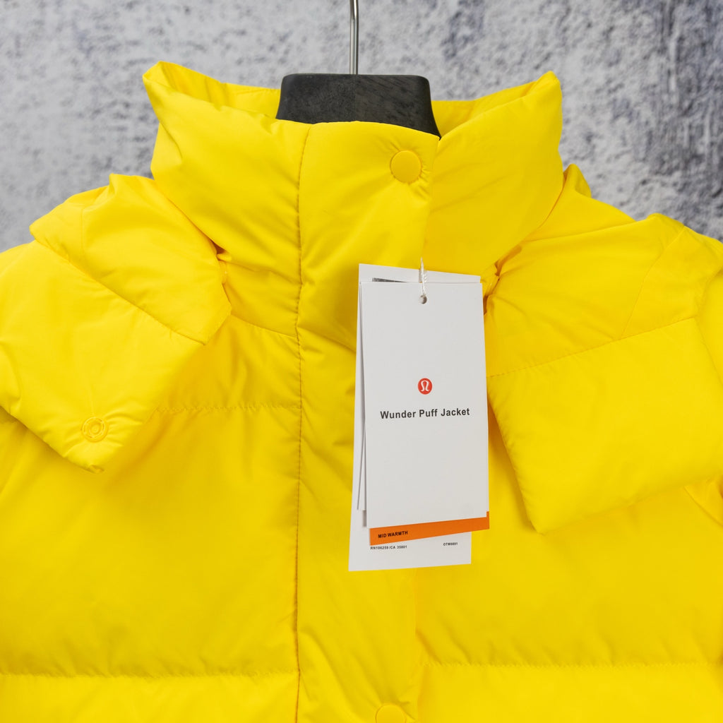 Yellow puffer jacket with hood and buttoned collar, hang tags