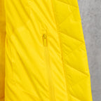 Yellow puffer jacket with front zipper and quilted panels
