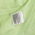 Light green puffer jacket label patch at inner collar