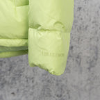 Lime green puffer jacket cuff with LULULEMON logo print