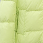 Light green puffer jacket sleeve and quilted front panel stitching