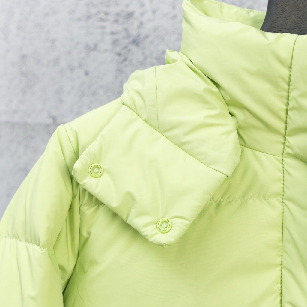 Lime green puffer jacket hood with snap buttons and stitched quilting detail