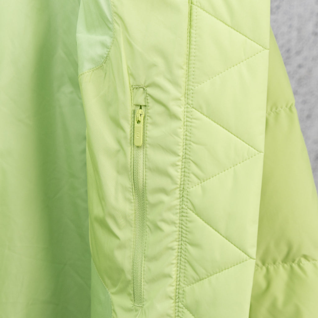 Lime green puffer jacket front seam with center zipper and quilted panels