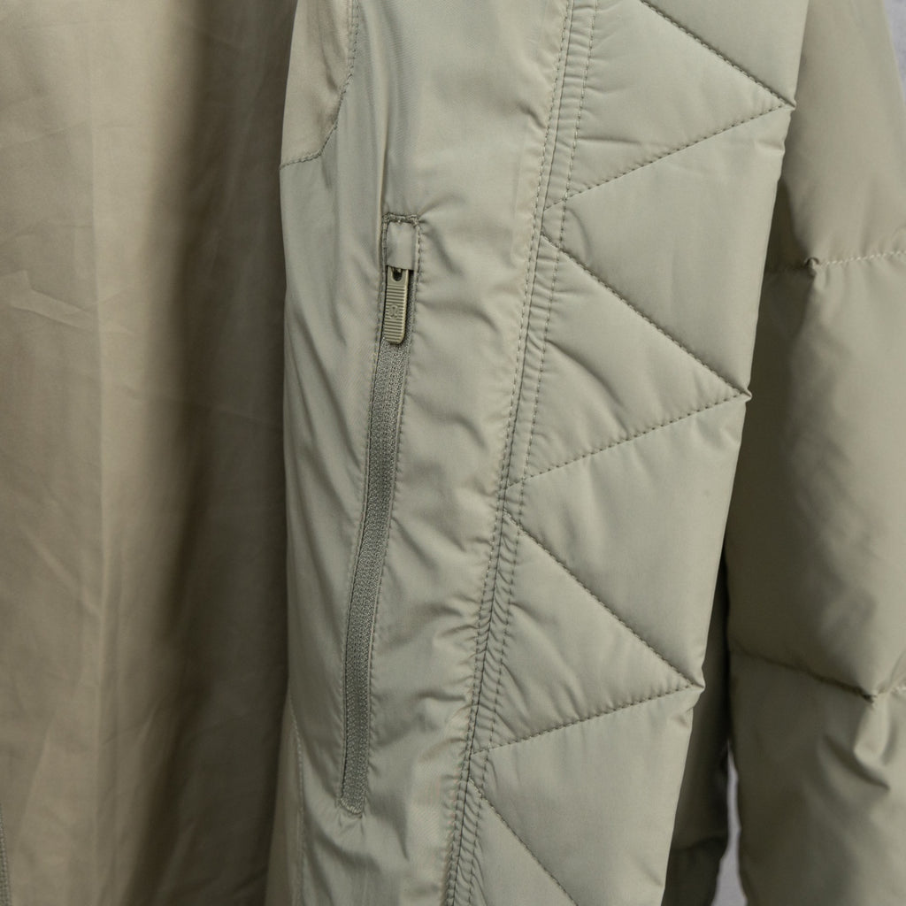 Beige puffer jacket with diagonal quilting and front zipper