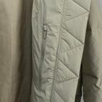 Beige puffer jacket with diagonal quilting and front zipper
