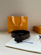 Brown monogram belt with dark buckle and wide strap