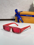 Red rectangular eyeglasses with glossy frames and dark lenses